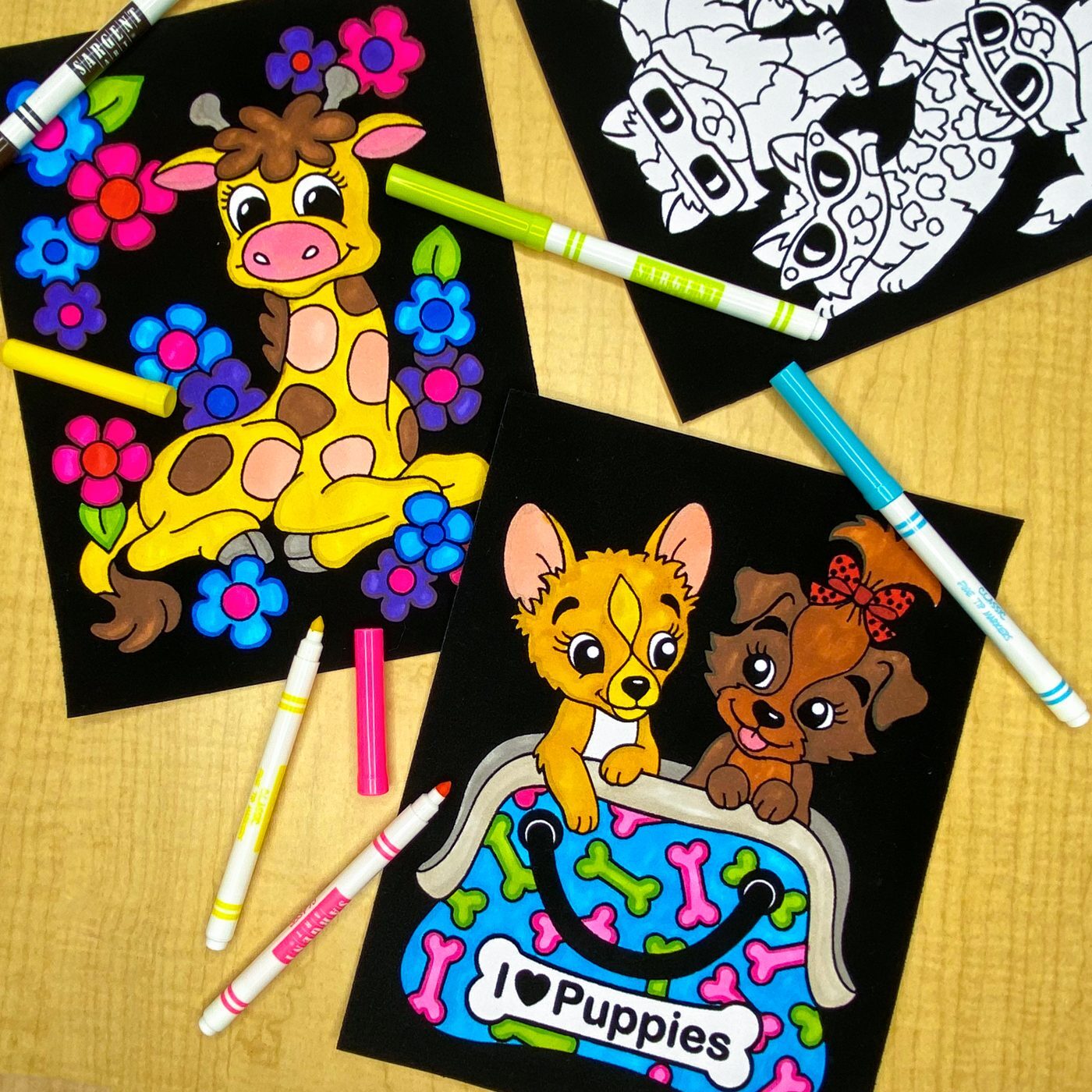 Giraffe and puppy fuzzy velvet posters colored with bright markers, next to an uncolored poster